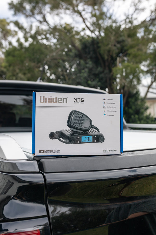 Uniden X75 in-car UHF CB radio retail pack shown on a vehicle Australia