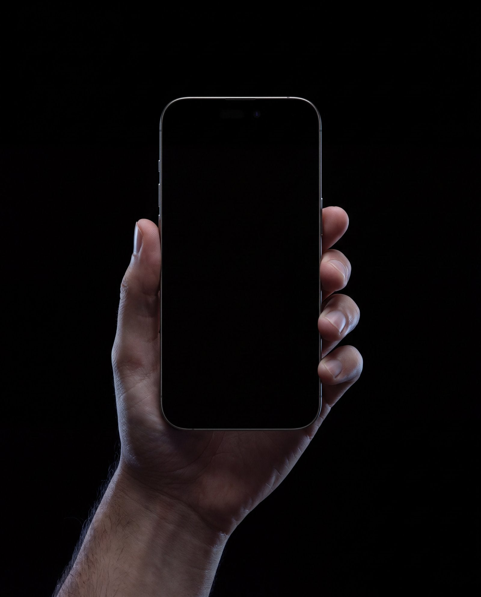A hand holding a phone running the Uniden app